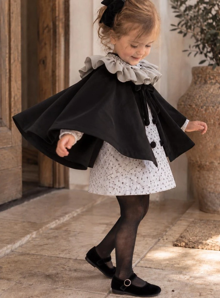 Azabache Collection: Smocked dress, bloomers, and velvet cape set.