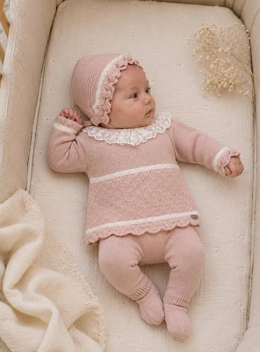 Baby girl's knitted outfit with bonnet and pale pink leggings