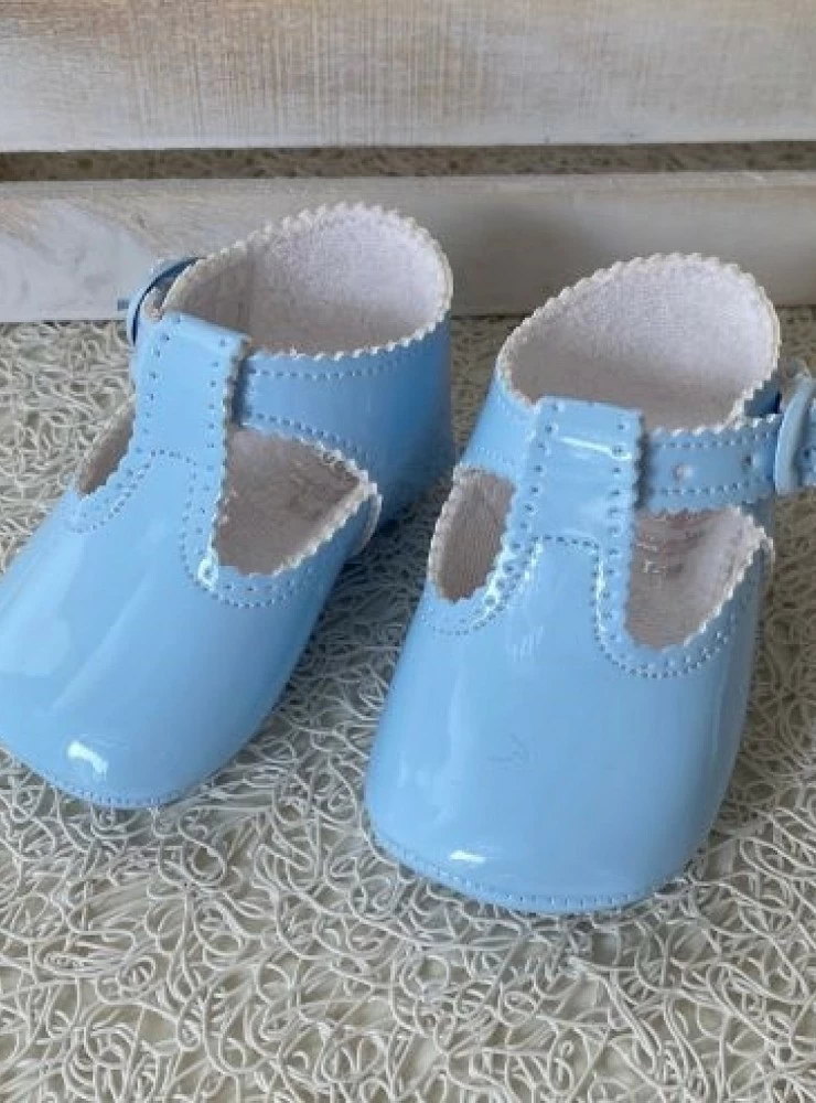 Baby shoe in light white or navy patent leather.