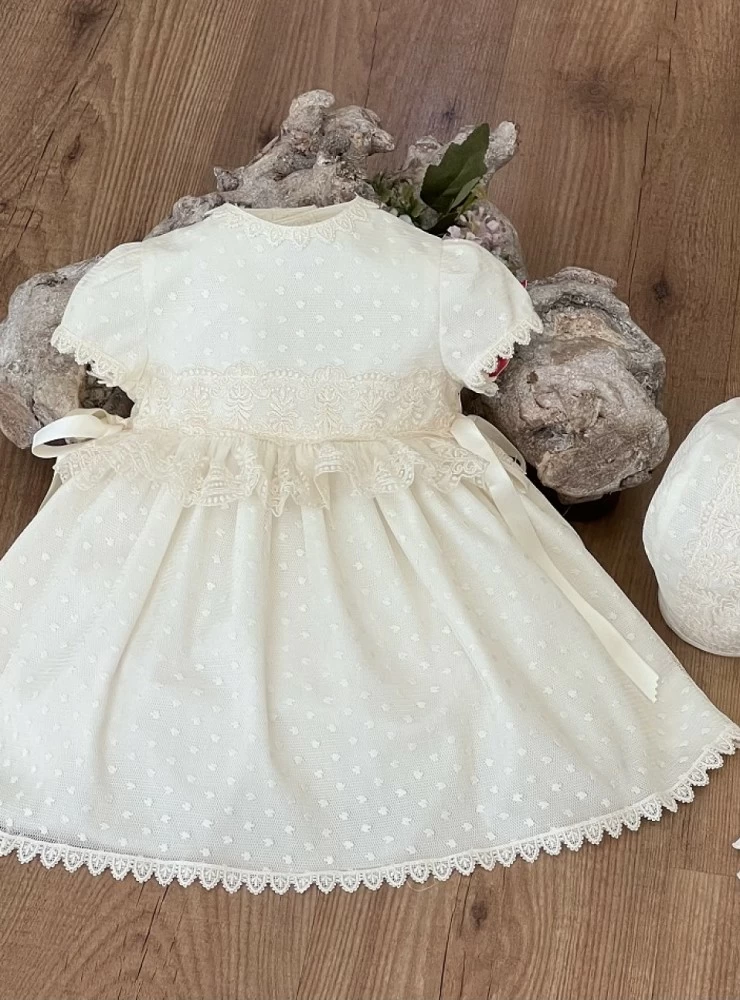 Beige tulle dress and bonnet set.