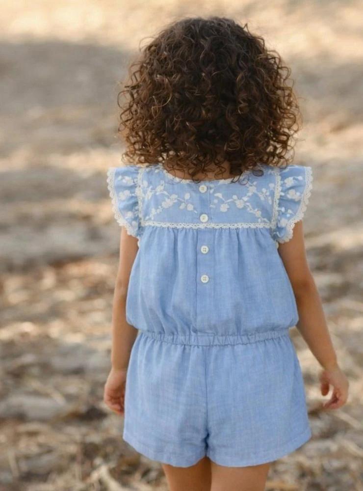 Blue jumpsuit for girls with embroidery. Surrey Collection