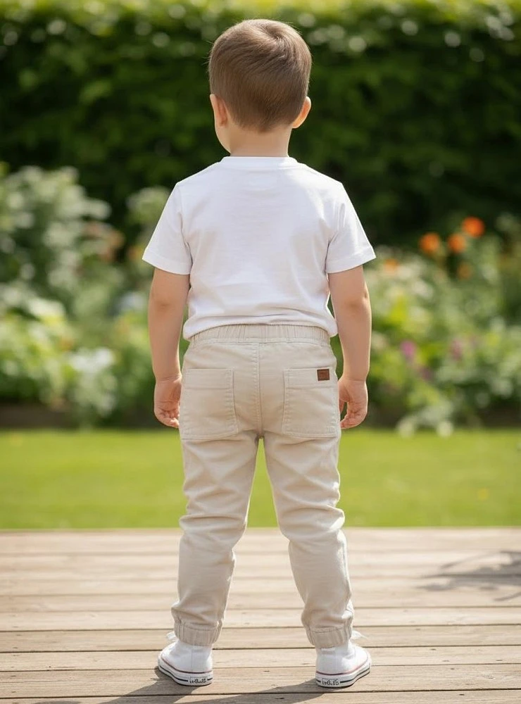 Boys' sand-colored jogger pants. Edmonton Collection.