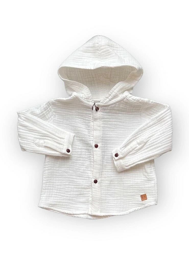 Camisa de bambula blanca para niño.