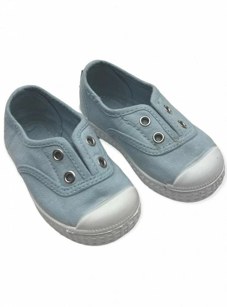 Canvas shoe with aqua green toe. Unisex