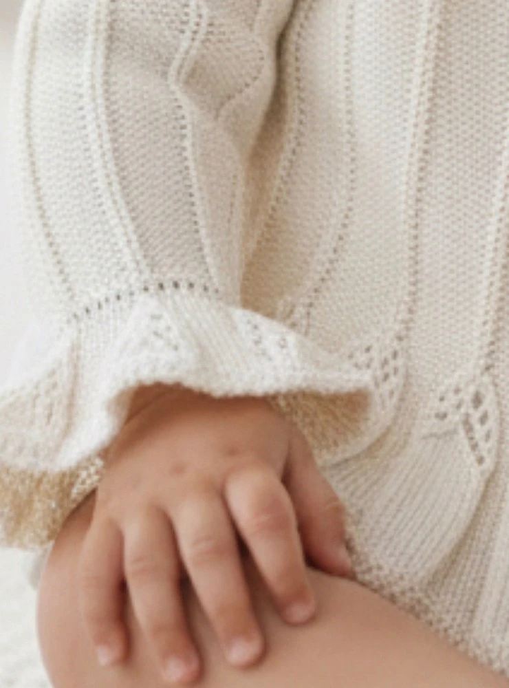 Champagne-colored knit jacket for girls, ideal for special occasions