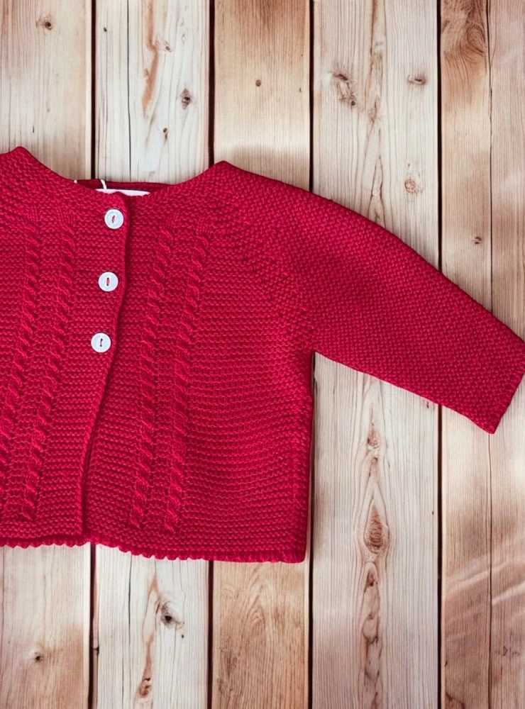 Chaqueta larga en punto liso. Es unisex
