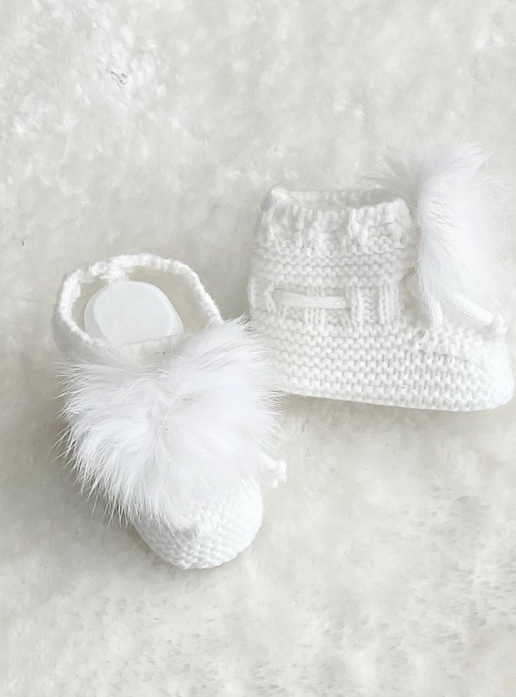 Chubby knit booties with natural fur pompom