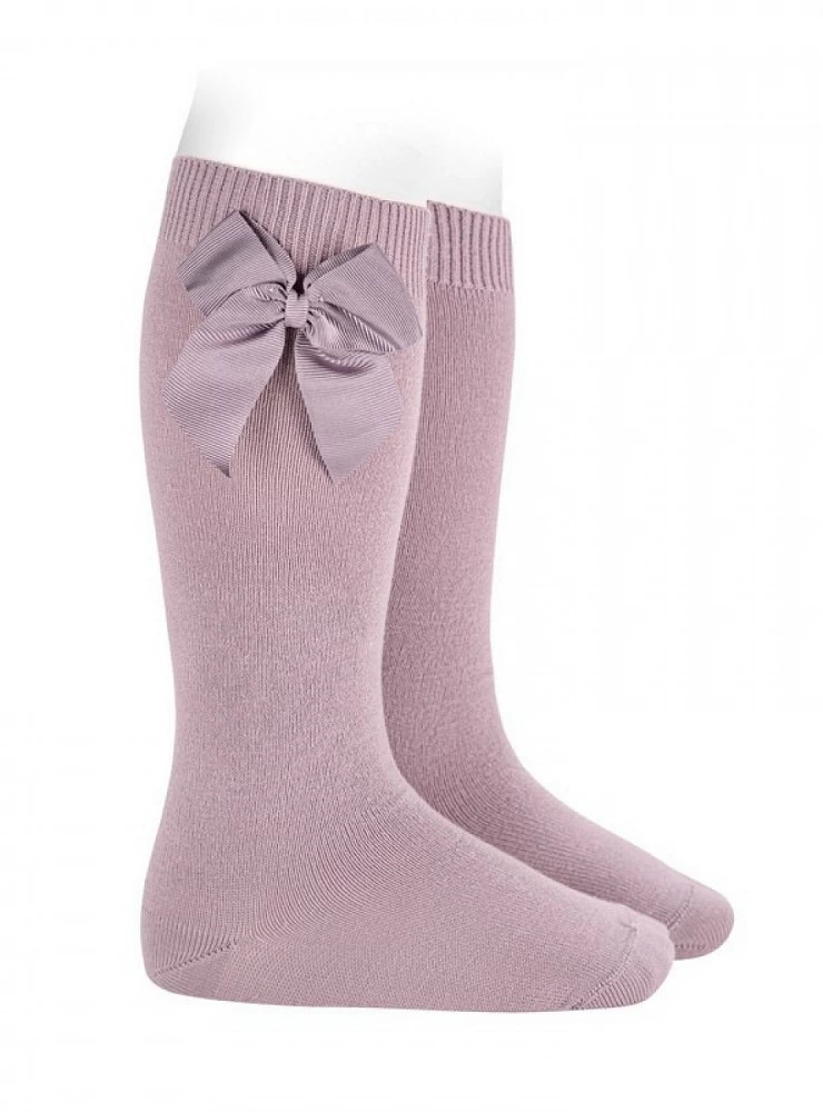 Condor brand knee-high socks or tights, plain knit, with bow. Color 130 Mother of Pearl.