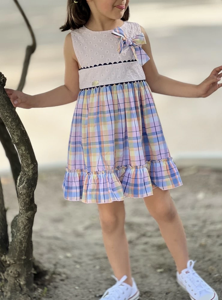 Dress with embroidered bodice and squares.