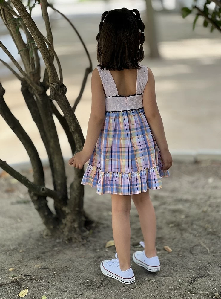 Dress with embroidered bodice and squares.