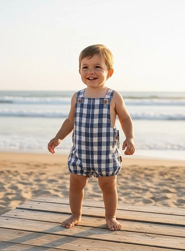 Dungaree romper in blue and white checks.