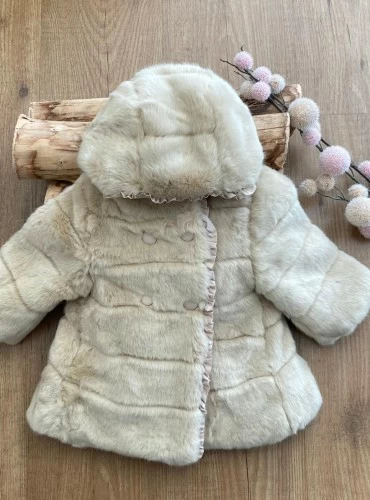 Girl's coat in sand-colored hair. Ideal