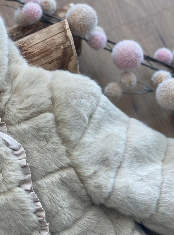 Girl's coat in sand-colored hair. Ideal