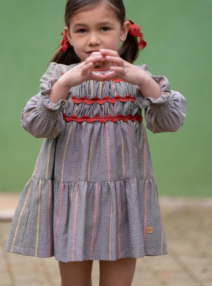 Girl's dress from the Nuez collection, herringbone check pattern with terracotta details