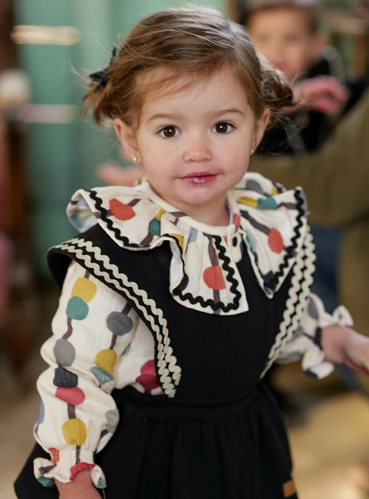 Girl's overalls and blouse set from the Luna Negra collection by José Varón