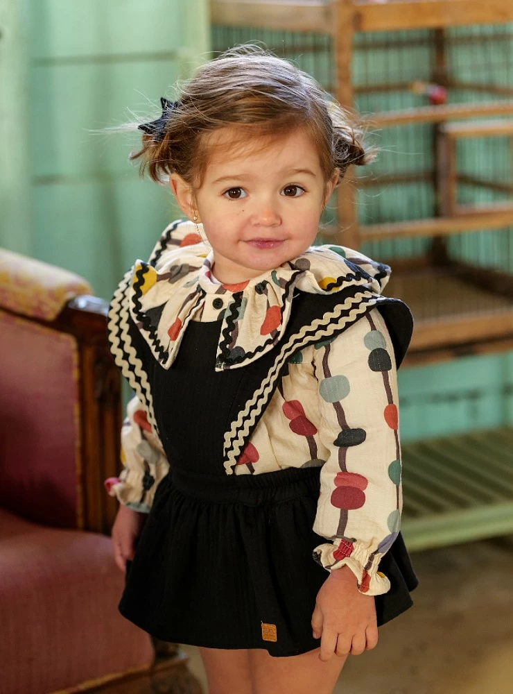 Girl's overalls and blouse set from the Luna Negra collection by José Varón