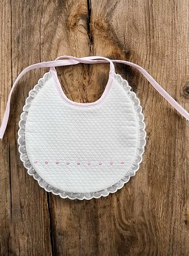 Hand-embroidered round bib. Unisex