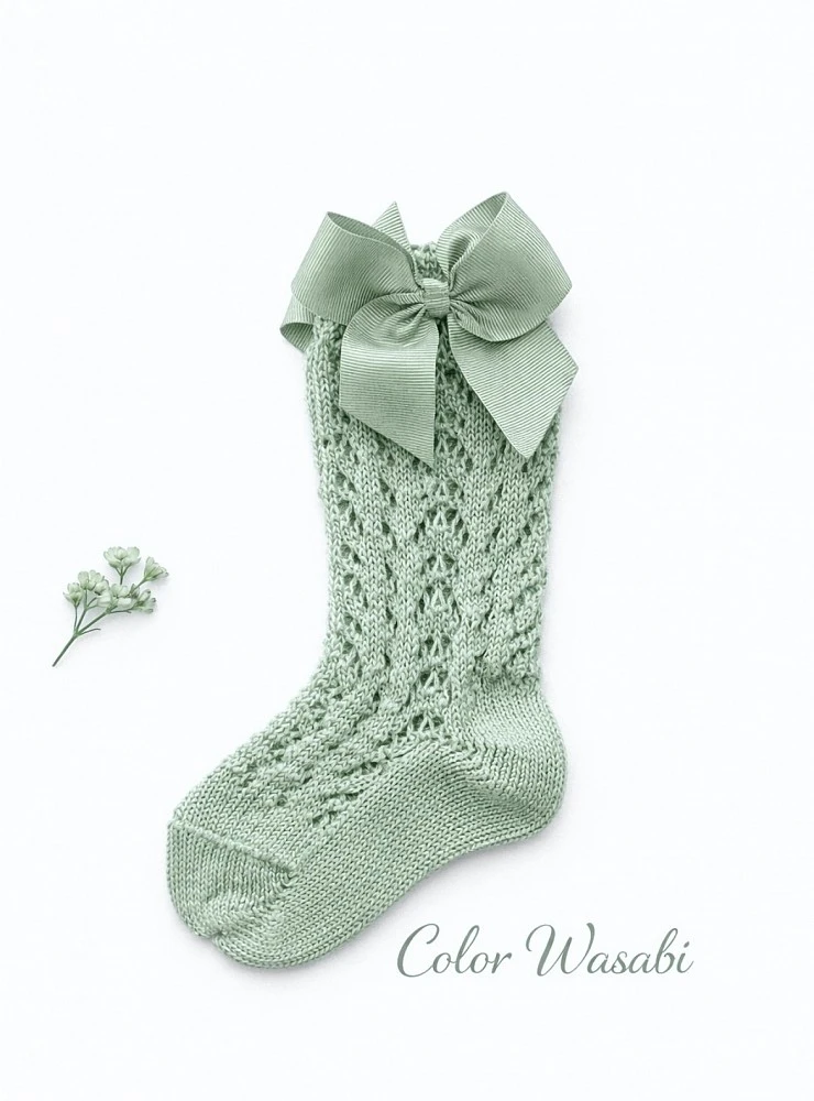 High sock or openwork shoes with drawstring on one side. Various colors