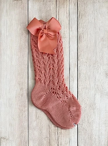 High sock or openwork shoes with drawstring on one side. Various colors