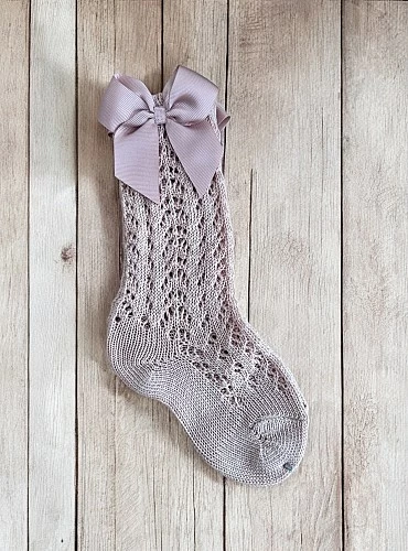 High sock or openwork shoes with drawstring on one side. Various colors