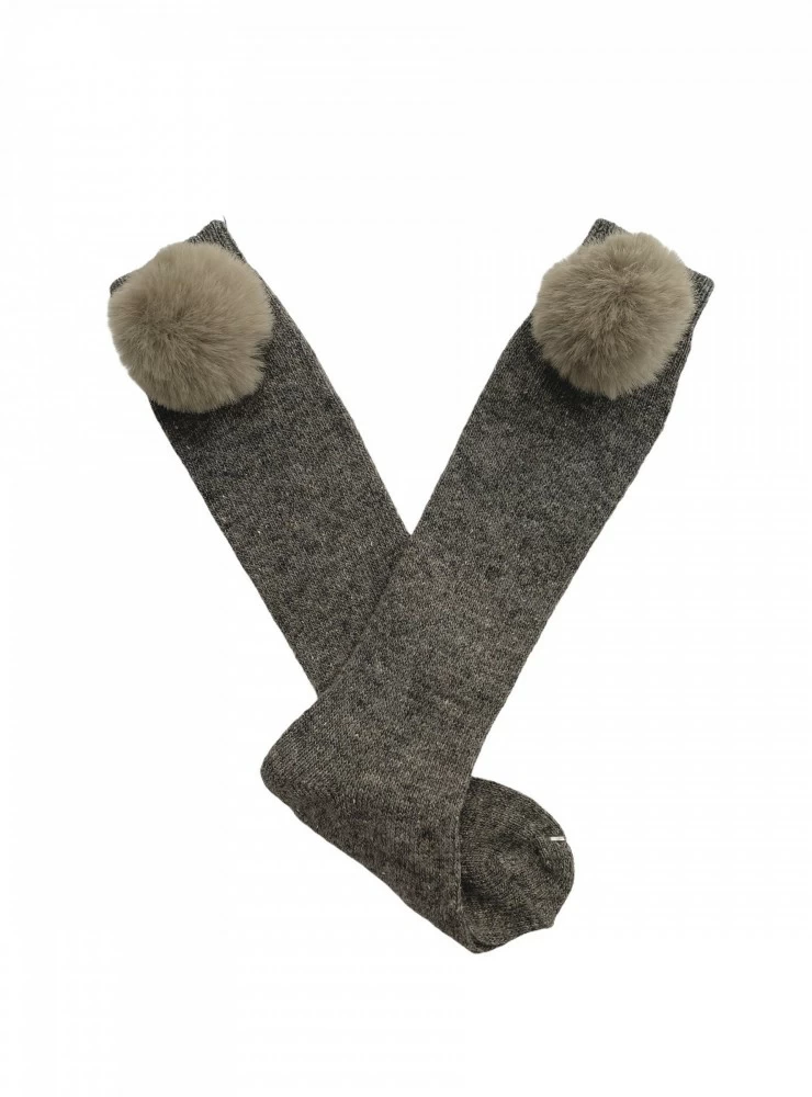 High socks or chubby knit leggings with fur pom pom.
