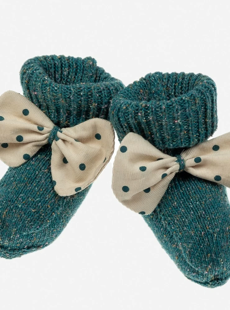 Knitted booties in night green with a loop of moles. O-Winter