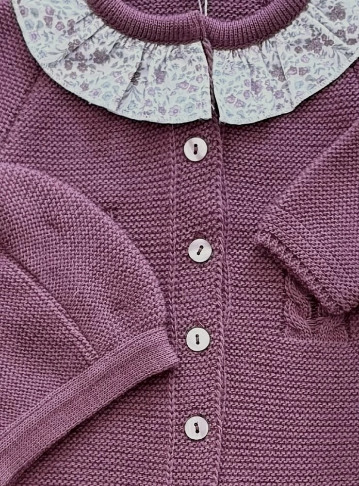 Knitted romper and bonnet for girls from the Solstice collection