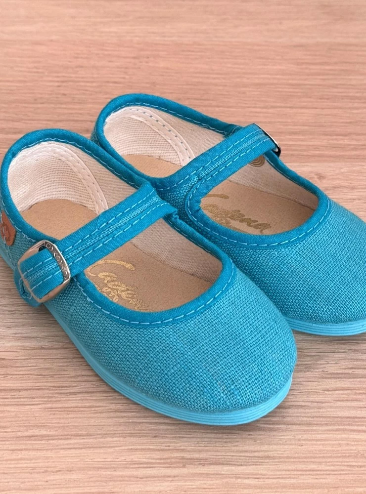 Linen Mary Janes in various colors.