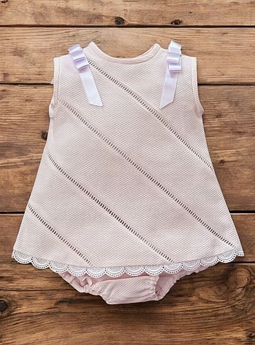 Little dress with pink and white panties.