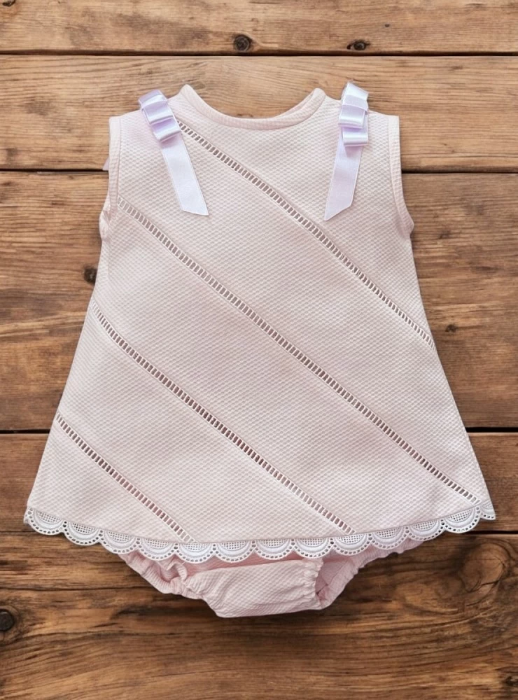 Little dress with pink and white panties.