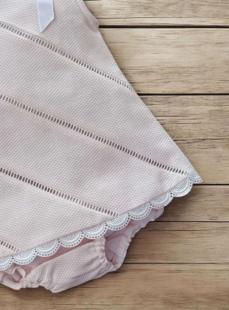 Little dress with pink and white panties.