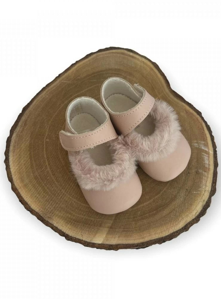 Little girl's shoe in two colors. Pink or beige with hair.