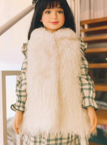 Long beige down vest. For girls.