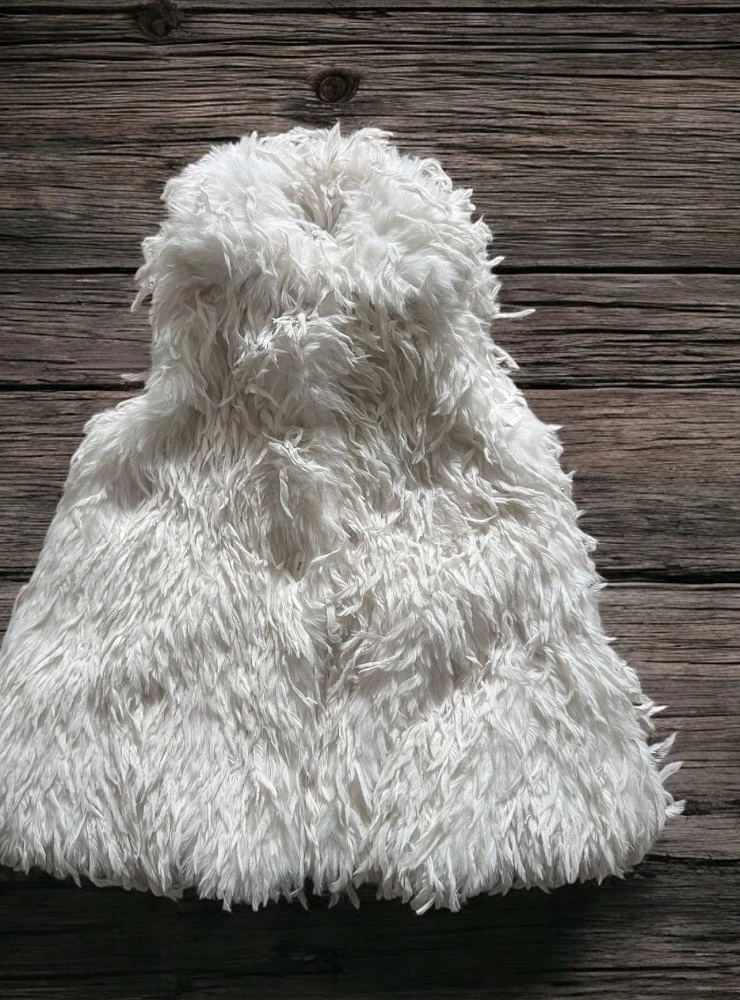 Long beige down vest. For girls.