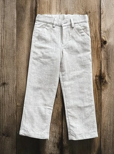 Long sand-colored linen trousers for boys.