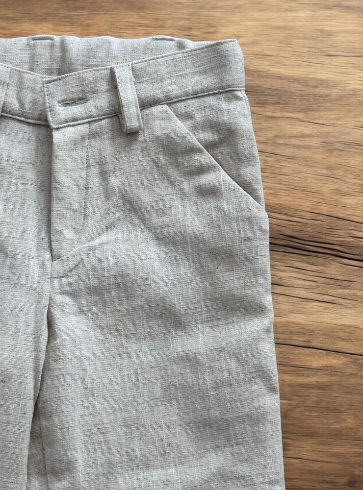 Long sand-colored linen trousers for boys.