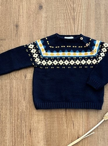 Navy knit sweater with border.