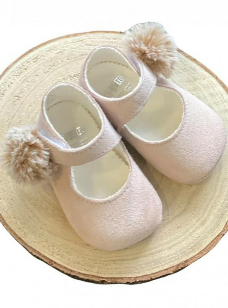 Pink suede shoe with camel pompom