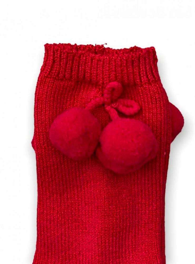 Plain high sock with tassels. unisex