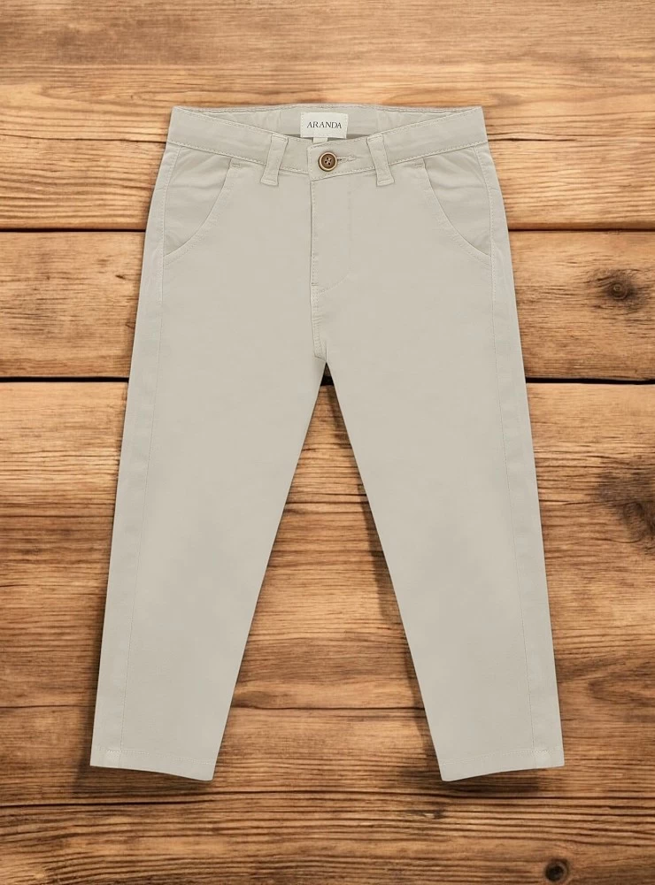 Sand-colored canvas pants.