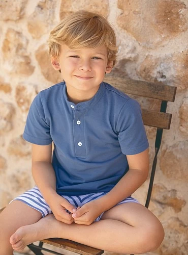 Set for boy. Blue polo shirt and striped pants.