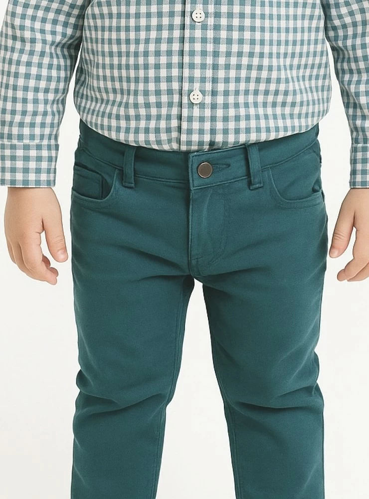 Skinny jeans in a bluish-green color