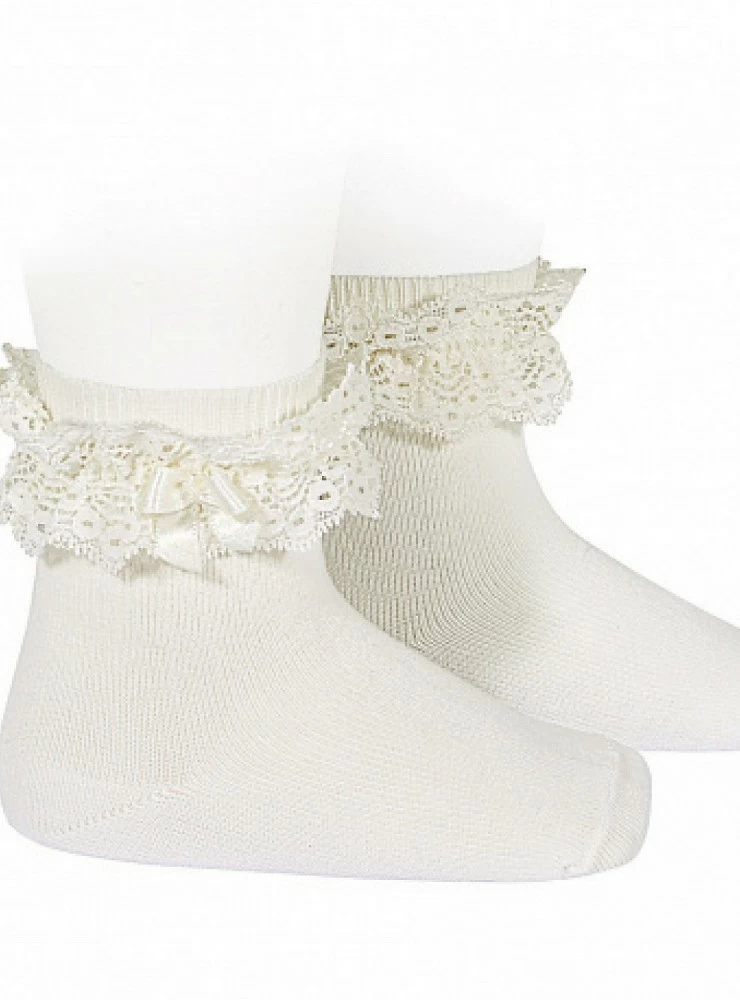 Sock with lace and cream-colored bow