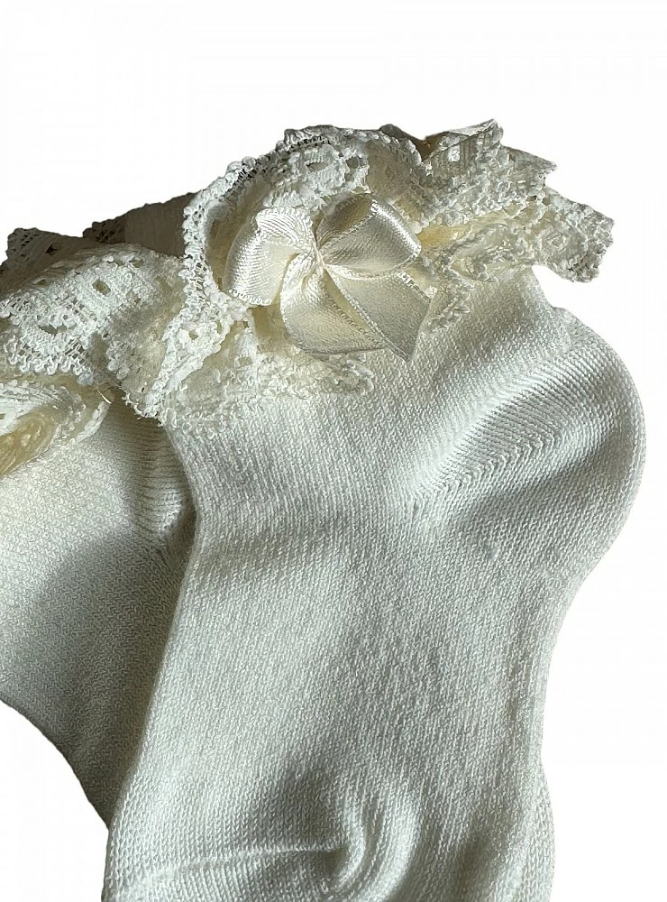 Sock with lace and cream-colored bow