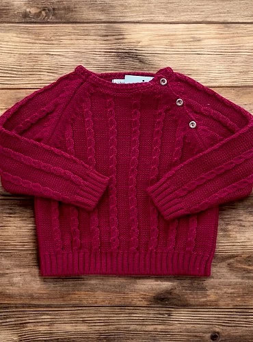 Two-tone boy's sweater. Cable knit.