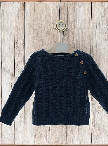 Two-tone boy's sweater. Cable knit.