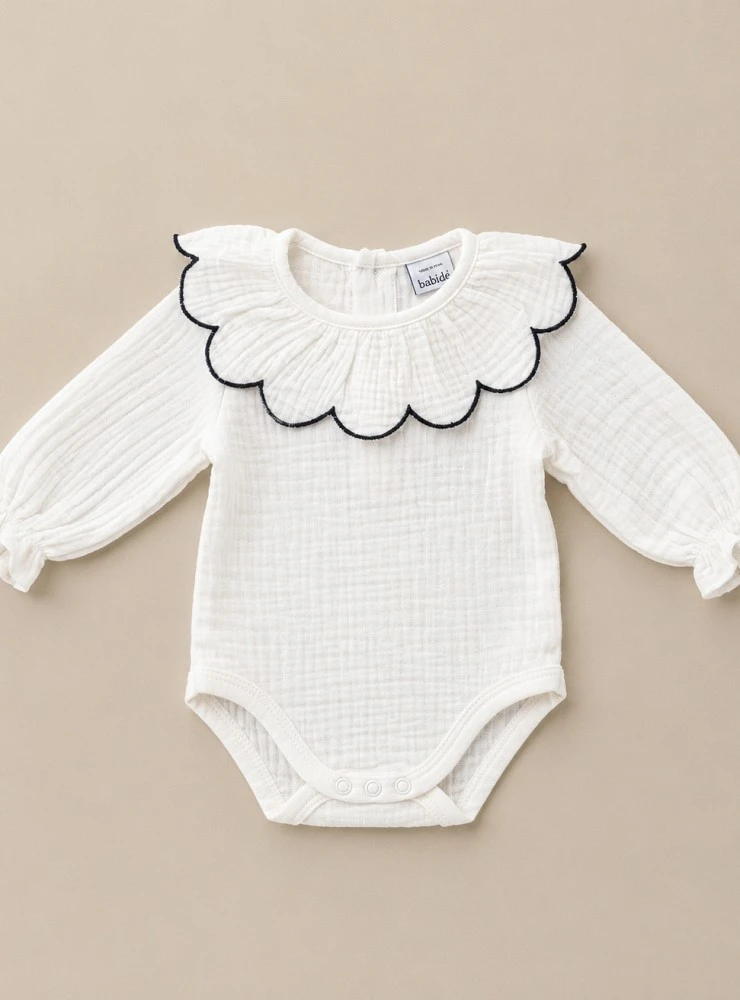 Unisex chambray bodysuit with a scalloped neckline