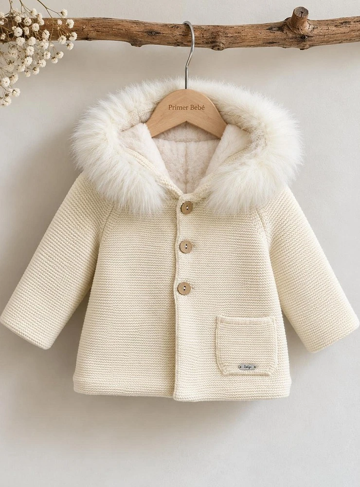 Unisex knitted duffle coat with a faux-shearling lining and a natural fur-trimmed hood.