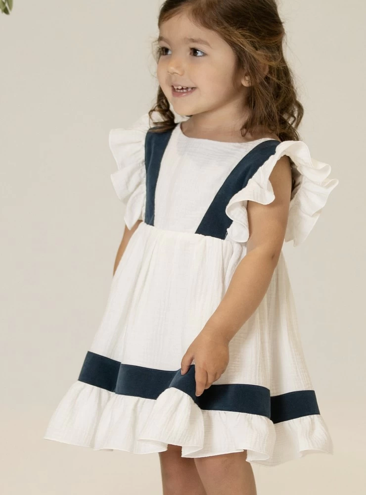 White and navy arras or ceremony dress by Eve Children