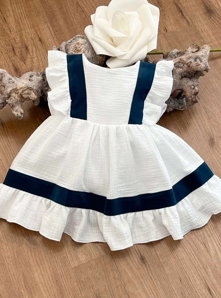 White and navy arras or ceremony dress by Eve Children